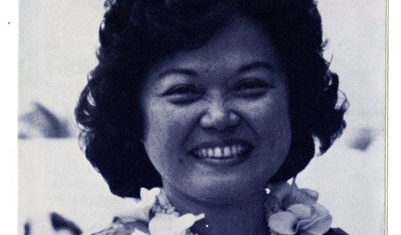 Patsy T. Mink wears a lei and smiles