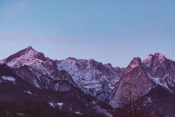 Alpenglow Embrace: The Last Light on Snow-Capped Peaks thumbnail