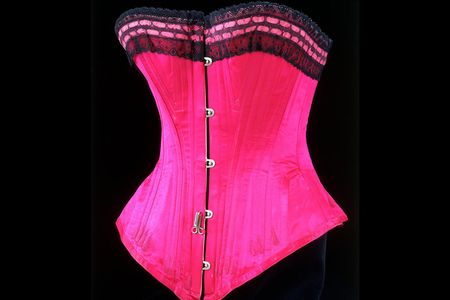 This silk satin, lace and whalebone corset gave an 1890s lady her hourglass figure and tiny waist. 