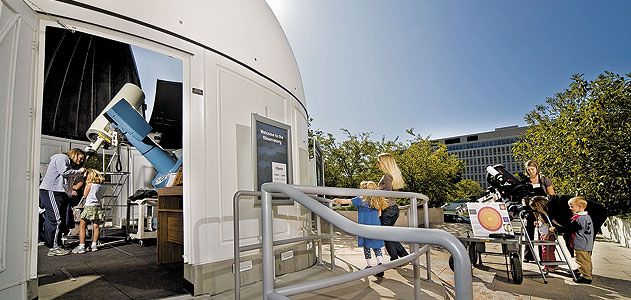 With telescopes both inside and out, Museum educators use a variety of filters to show visitors spots on the sun, craters on the moon, and the phases of Venus.