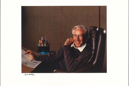 Renowned photographer Yousuf Karsh captured this shot of Charles Schulz at his studio, pen in hand. On the drawing board before him is a partially completed Peanuts Sunday comic featuring the latest episode in the continuing saga of Charlie Brown, Lucy, and the snatched football.