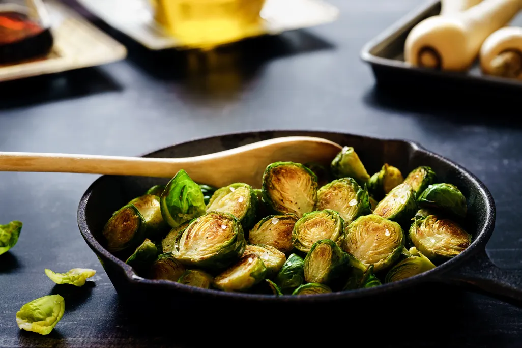 Cast iron skillet full of Brussels sprouts