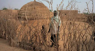 In the Nigerian village of Tajaé, a woman named Rakany (with her great-grandson) says she was given as a slave to her owner when she was an infant. She is now 80 years old.