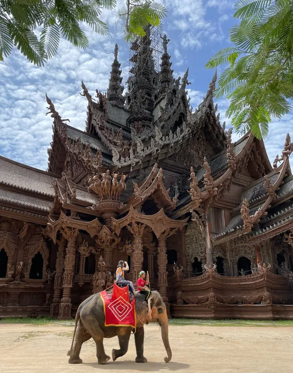 An elephant ride at the Sanctuary of Truth museum in Pattaya, Thailand thumbnail