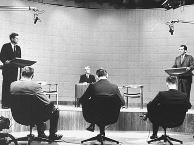 On September 26, 1960, presidential candidates Richard M. Nixon and John F. Kennedy stood before cameras for the first-ever televised presidential debate.