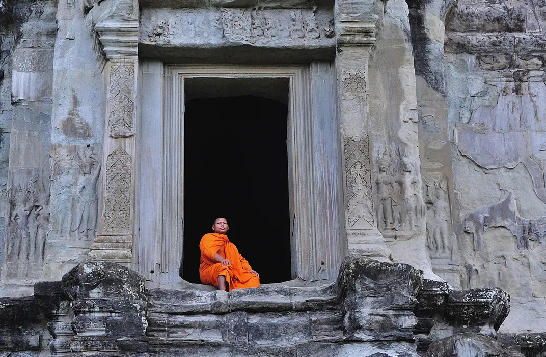 Monk in doorway at Angkor Wat