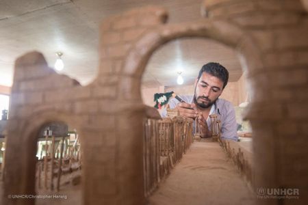Mahmoud Hariri, from the city of Dara'a, is building a replica of the city of Palmyra from clay and wooden skewers.