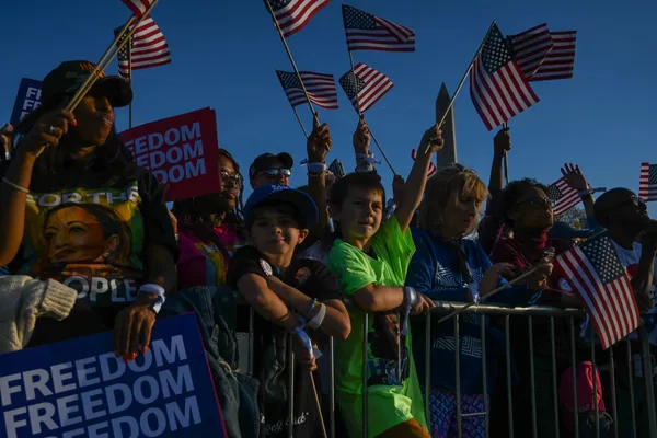 Children supporting America at a campaign rally for Kamala Harris thumbnail