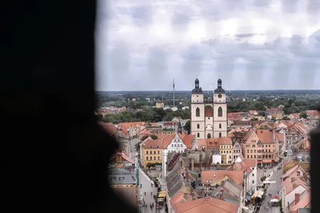 Towers of the Stadtkirsche rise above Wittenberg, Germany. Much of the church was demolished and replaced in 1522, but the “Judensau” has remained despite controversy.
