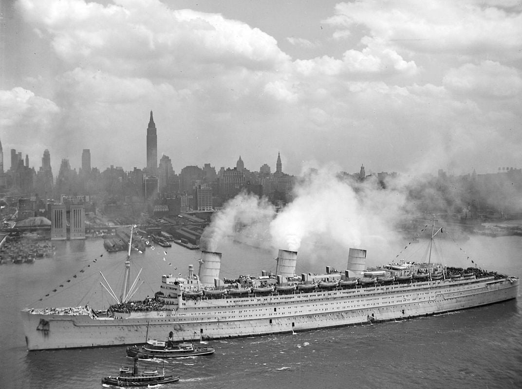 The Queen Mary arriving in New York Harbor on June 20, 1945, with thousands of American soldiers on board