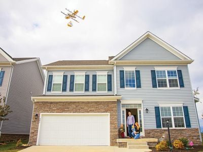 A Wing 7000 drone makes a delivery to a Christiansburg home from its designated 23-foot hover altitude, where it will lower the up to three-pound package on a breakaway tether. It flies 130 feet above ground level.