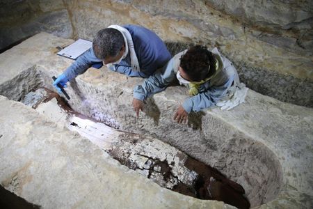 Researchers examine a seven-and-a-half-ton limestone sarcophagus in a mummification workshop that dates back to ancient Egypt.
