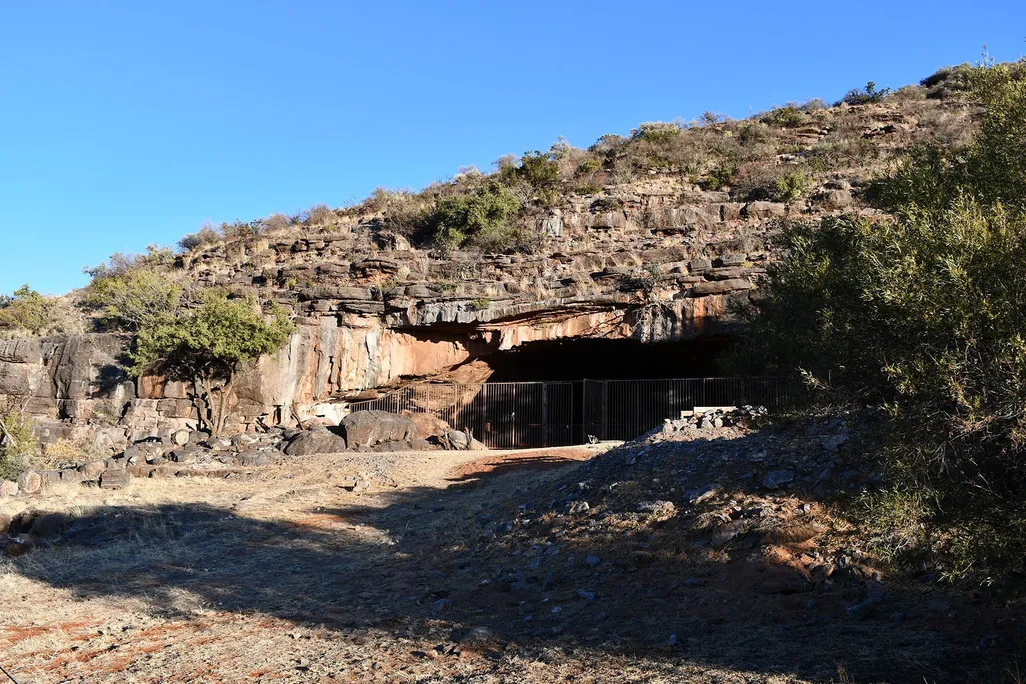 Entrance to cave with metal fence