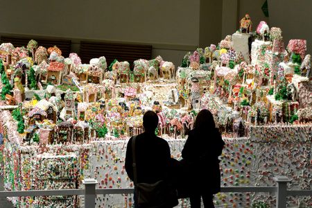 Jon Lovitch stands in front of the 2013 incarnation of GingerBread Lane. The village becomes larger and more elaborate each year. 