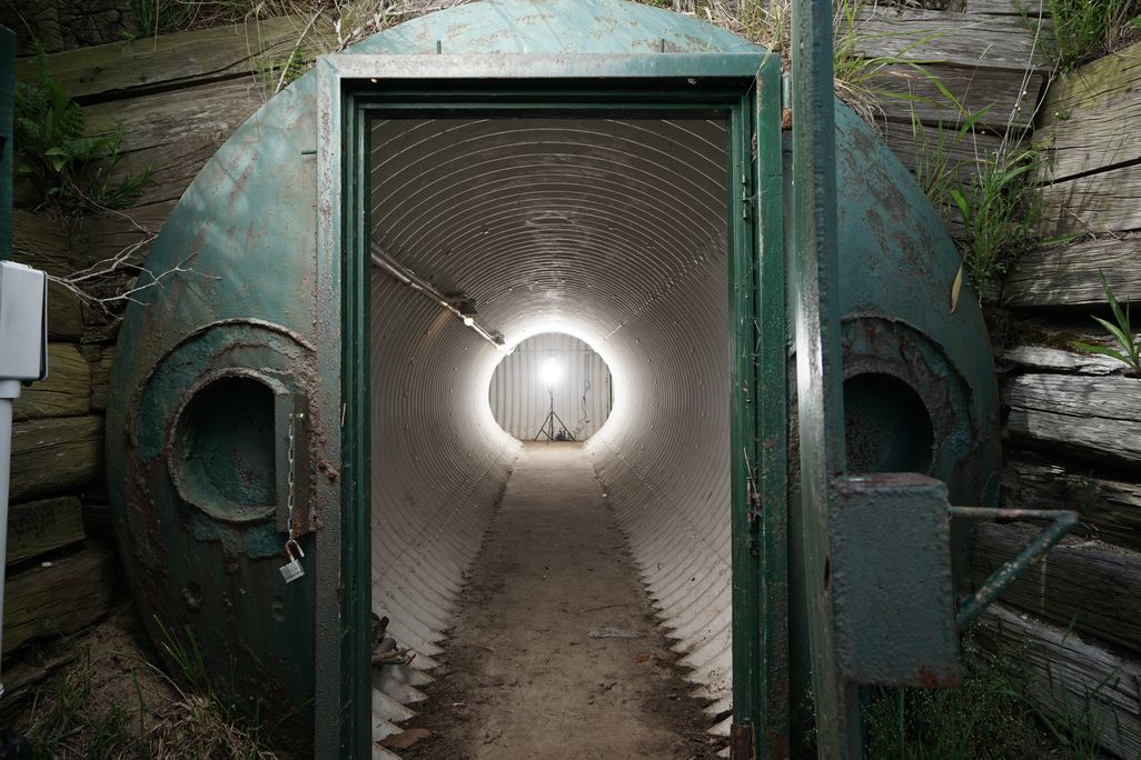 Door to JFK's Nantucket nuclear fallout shelter, with long corridor visible in the distance