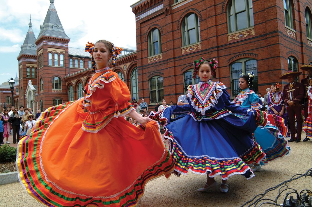 Los Quetzales dance ensemble in front of the Smithsonian Institution's Arts and Industries Building in 2003