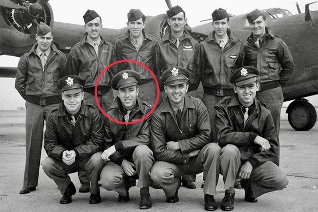 Black and white photo of soldiers with a red circle around one of their faces