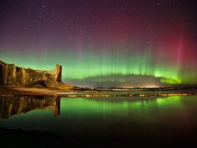 The northern lights glow over Castle Sands in Saint Andrews, Scotland at 10 P.M. Sunday, March 6, 2016. Captured by Aurorasaurus participant Alex Thompson 