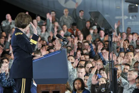 Previously deployed service members raise their hands at Joint Base McGuire-Dix-Lakehurst in New Jersey.