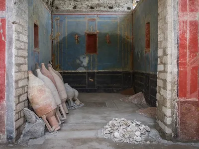 See the Stunning Shrine With Rare Blue-Painted Walls Unearthed at Pompeii image