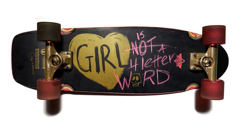 Skateboard reading "Girl is not a 4 letter word"