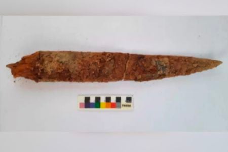 This iron dagger's well-preserved wooden handle may help researchers date artifacts found in Konthagai.