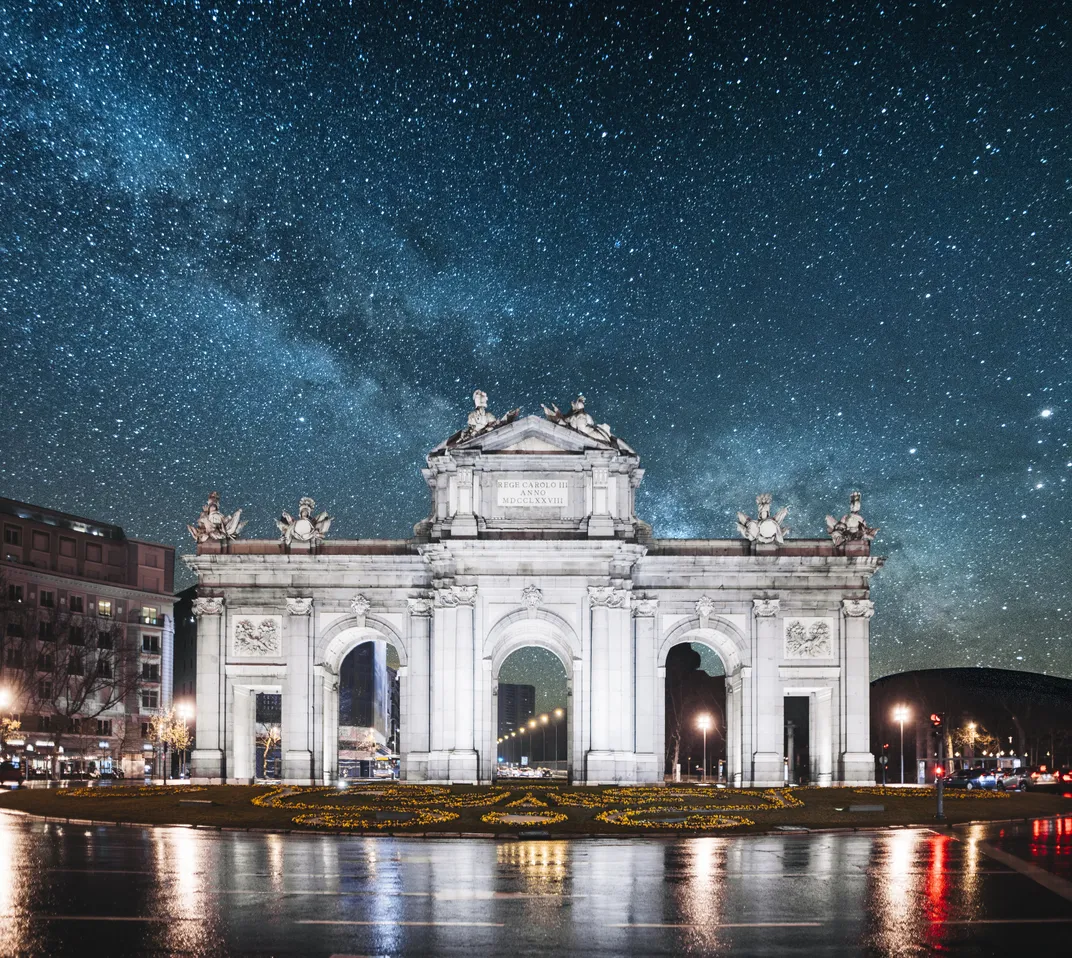 The Milky Way dazzles over Madrid's Puerto de Alcalá.