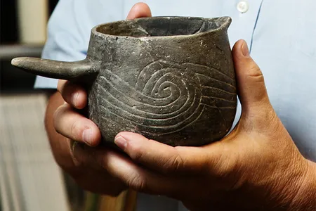 Pottery beakers were used to hold the “Black Drink”.