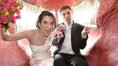 Newlyweds Scott and Amanda Peters inside the mouth of Cabazon Dino Park's Tyrannosaurus.