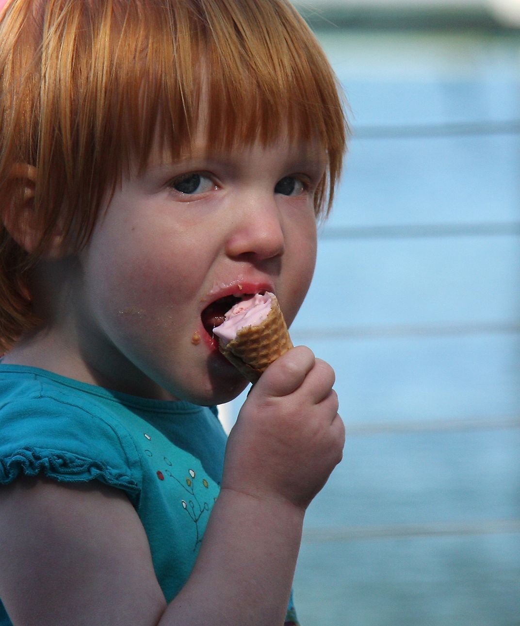 15 - A little redhead nears the end of her ice cream cone. It’s not over until it’s over.