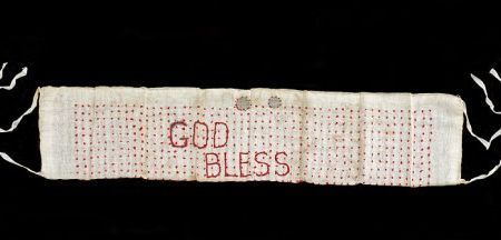 While held at the Poston camp in Arizona, Yasu Takei made this one-thousand-stitch sash to bestow good luck and protection to her son Jim Kuichi Takei, who was fighting with the 442nd in Europe. (NMAH)
