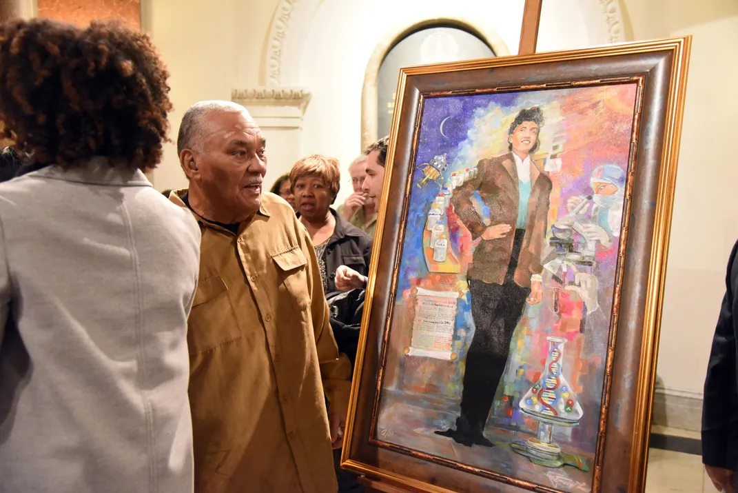 Henrietta Lacks's son looking at a portrait of his mother