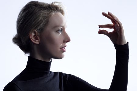 Elizabeth Holmes holds a vial of one drop of blood—all that's needed for a new method of simultaneously testing for a gamut of health threats, such as STDs, heart disease and diabetes.