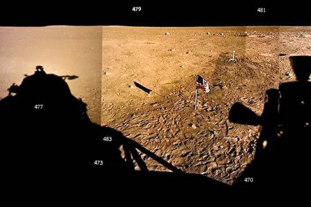 The shadow of their lander dominates a mosaic of the numbered photos Neil Armstrong and Buzz Aldrin took out their window before leaving the moon.