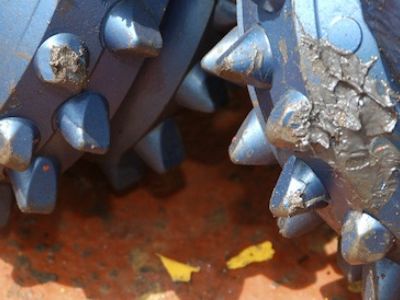 Tungsten carbide drill bits will grind through miles of ultra-hard igneous seafloor rock in hopes of reaching the mantle.