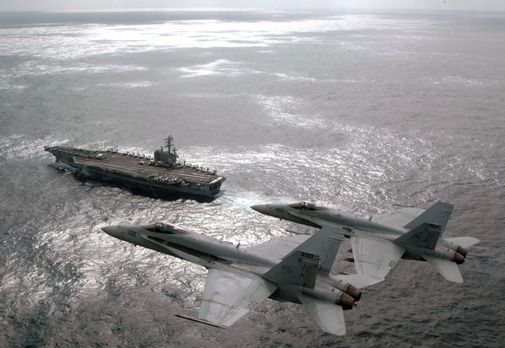 A pair of Hornet pilots hold a change of command ceremony in the sky.