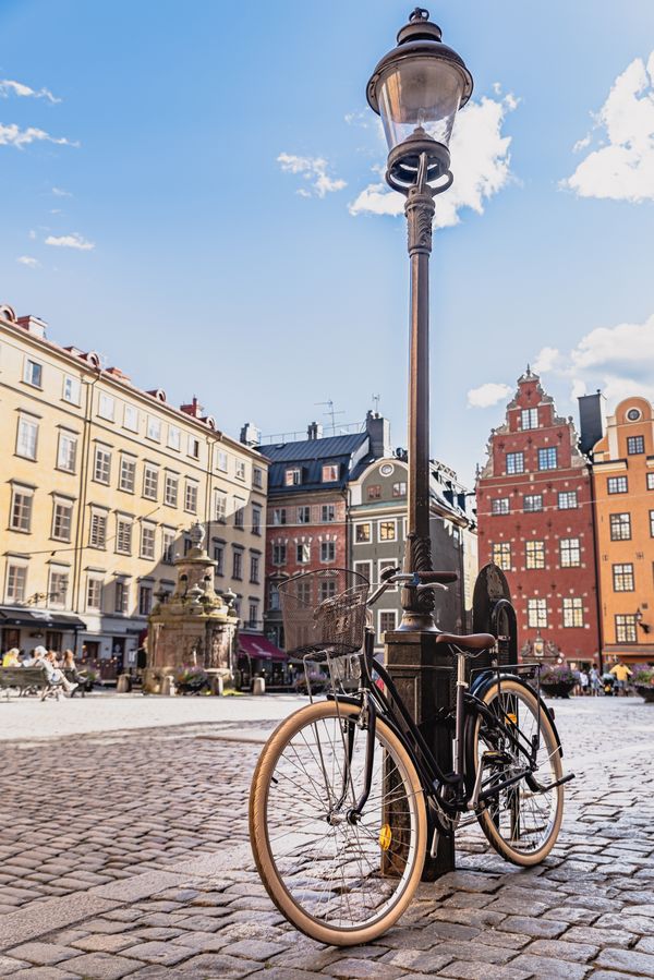 old-faschioned bicycle leaning against a lamppost in Stockholm Gamla Stan thumbnail
