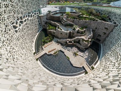 A view from the cell wall of the Shanghai Natural History Museum, looking down on the north tectonic wall made of stone.