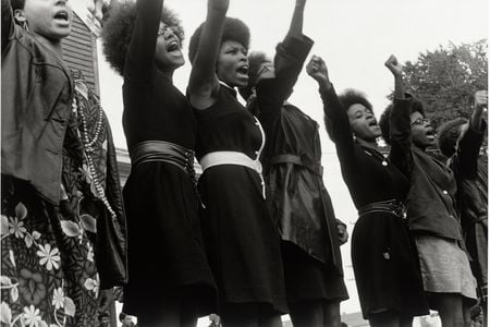 A photo taken at a Free Huey Newton Rally in 1968 with five of the six women identifiable—Delores Henderson, Joyce Lee, Mary Ann Carlton, Joyce Means and Paula Hill—provides testament to those who actualized the daily operations of the Black Panther Party.
