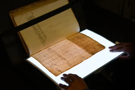 A lightsheet used to reveal hidden text in a manuscript of William Camden&#39;s Annals.&nbsp;New research suggests the author reworked his biography of Elizabeth I to win the favor of her successor, James VI of Scotland and I of England.