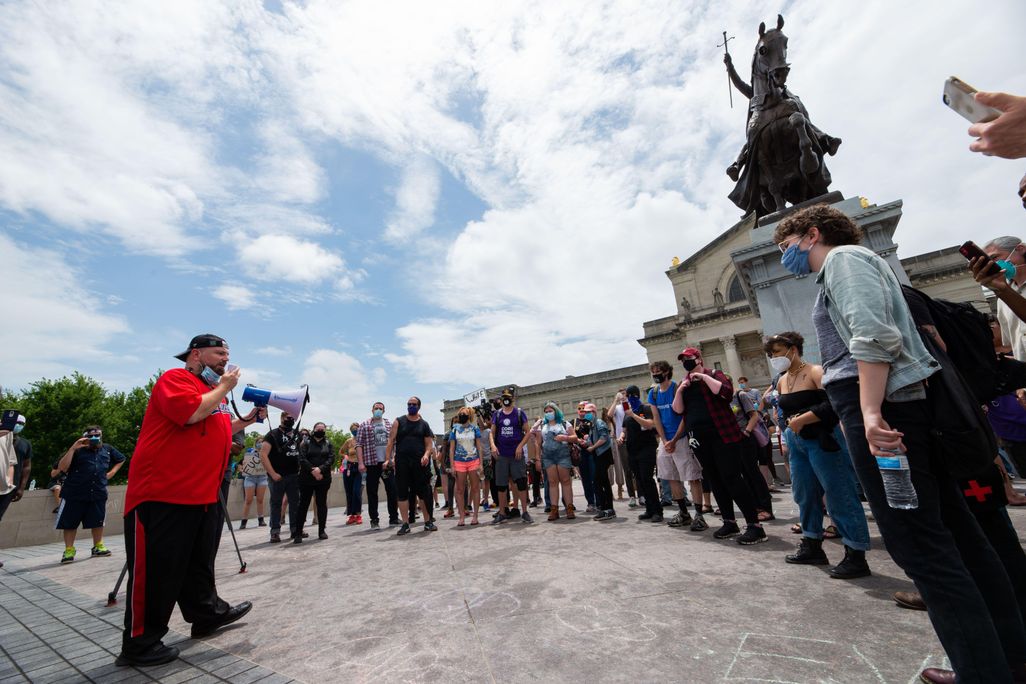 Protesters gather around statue of St. Louis