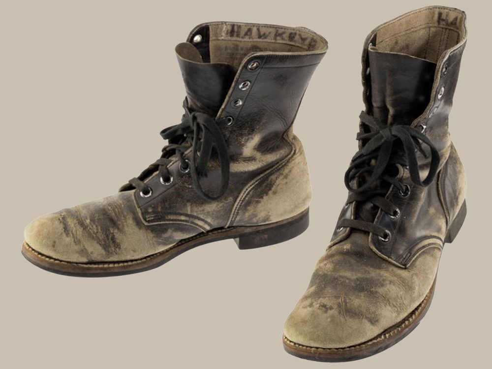 Alan Alda's scuffed combat boots