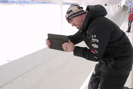 Zach Lund, a former Olympian and head driving coach for the U.S. bobsled team, films an athlete training in Lake Placid, N.Y. for the Sochi Olympics using Ubersense, an app that allows for real-time video analysis.