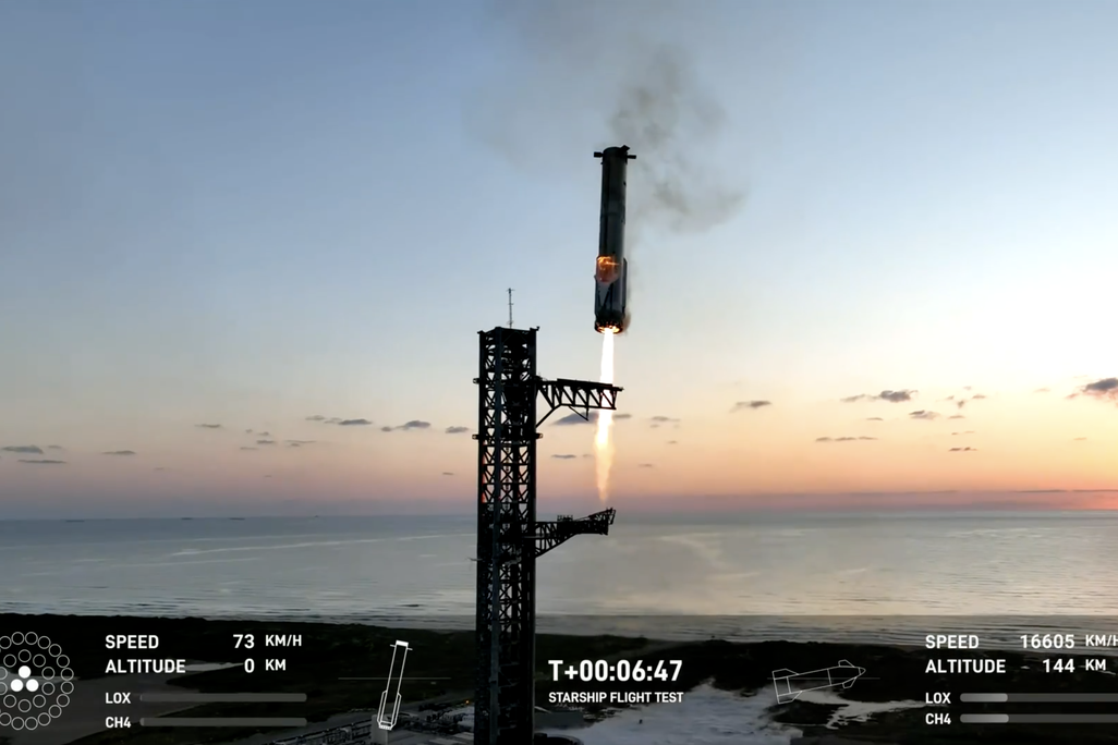 The Super Heavy booster returning to the launch tower