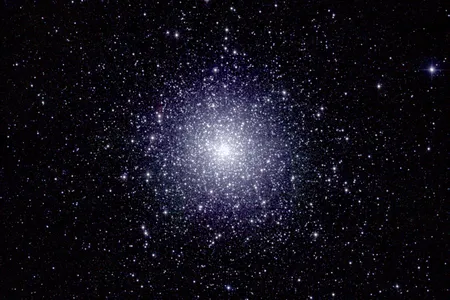 An infrared image of 47 Tucanae, a dense globular cluster of stars located roughly 16,000 light years from Earth. A new study has predicted that a black hole lies at its center.