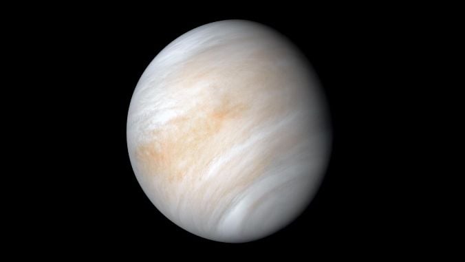 Venus, a ball of swirling light brown, white and grey, framed against a jet black background