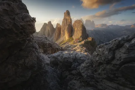 A red-roofed residence is nestled in the rocks at the feet of the Cadini di Misurina.