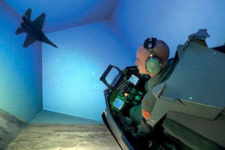 Major Brandon “Cracker” McBrayer, an instructor pilot at Luke, merges with a MiG-29 adversary in a flight simulator. One Viper pilot equates flying the F-16 to "driving a Ferrari, whittling a piece of wood, and playing Stratego—all at the same time."