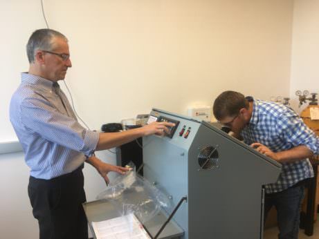 Jacek Koziel, left, and Devin Maurer analyze odor samples from a swine farm.