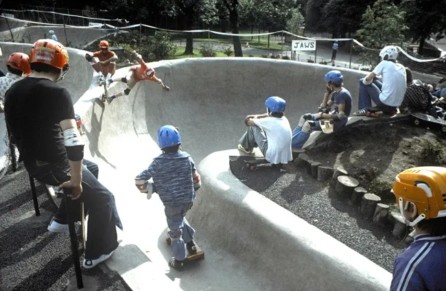 Children skateboarding on "Jaws" bowl